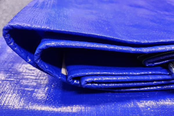 Extra heavy-duty 320GSM PE tarpaulin fold detail with Reinforced rope edges